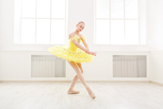 Ballet student exercising in ballet costume