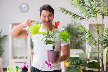 Young man in gardening concept at home