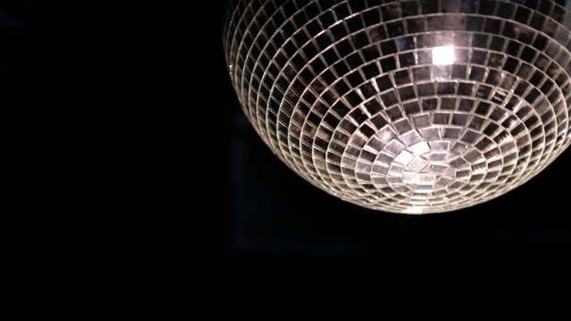 disco ball spinning in a dark room