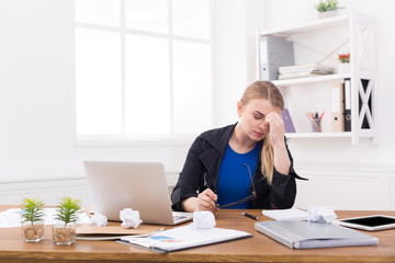 Tired pregnant businesswoman at office copy space