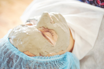 Close up of woman face during cosmetology procedure