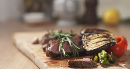 piece of rib eye steak with vegetables