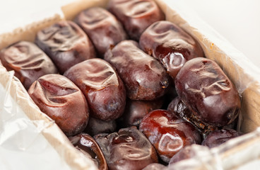 dates, phoenix dactylifera in packing container, close up