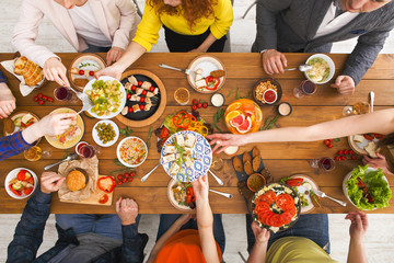 People eat healthy meals at served table dinner party
