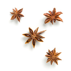 Fototapeta na wymiar Star anise, scattered in a chaotic manner, isolated on white background
