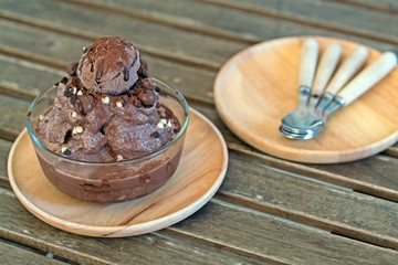 chocolate Ice cream ball on Shaved Ice dessert on wooden table