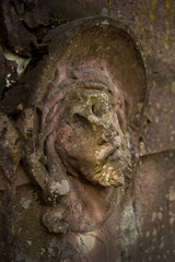 The face of Jesus Christ on the grave at the old cemetery.