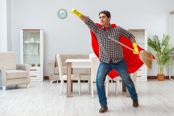 Super hero cleaner working at home