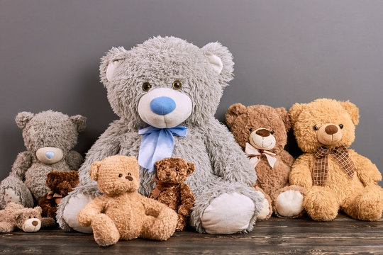 Naklejki Teddy bears on wood surface. Cute soft toys. Toy buying guide.