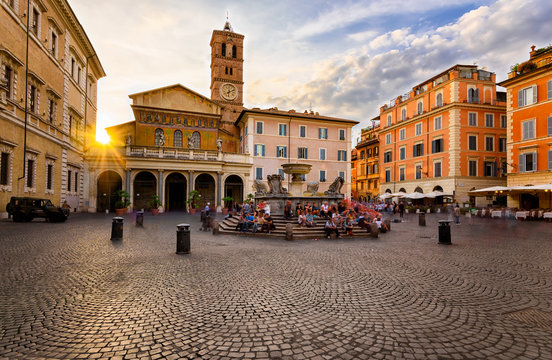 Fototapeta Basilica di Santa Maria in Trastevere and Piazza di Santa Maria in Trastevere at sunset, Rome, Italy. Trastevere is rione of Rome, on west bank of Tiber in Rome. Architecture and landmark of Rome.