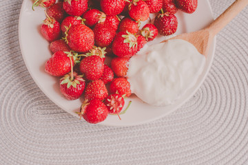 Bunch of bananas and strawberries. Photo toned style Instagram filters. Concept of healthy breakfast. Flatlay