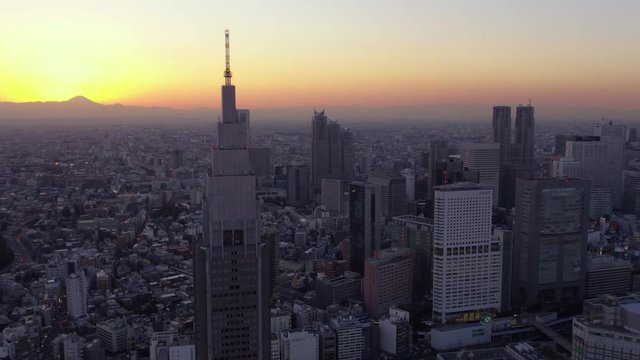 Japan Tokyo Aerial v16 Flying low around clock tower with cityscape views sunset Mount Fuji 2/17