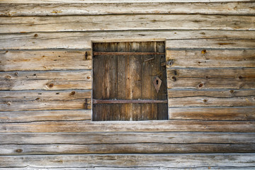 Timber made hatch in a wooden wall
