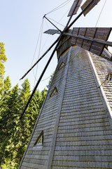 Obraz premium Ancient wooden windmill in forest