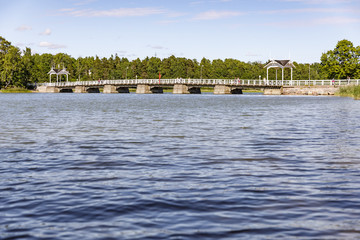 White pedestrian bridge over water