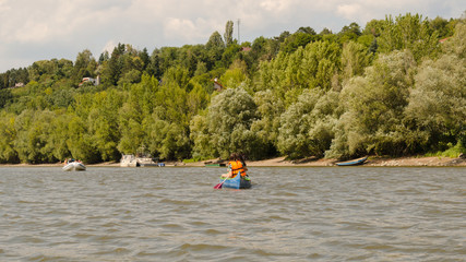Fototapeta na wymiar conoeing on river in summer. water activity on water in summertime 