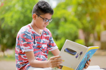 Indian child reading a book