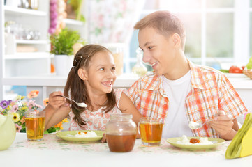 happy  kids having breakfast 