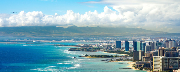 Honolulu Coastline with an Airplane Flying