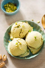 Pistachio ice creams on blue plate 