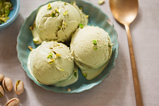 Pistachio ice creams on blue plate 