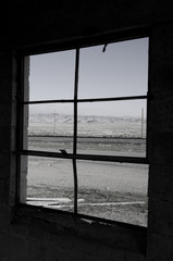 Looking Out Window at Ghost Town of Cisco, Utah