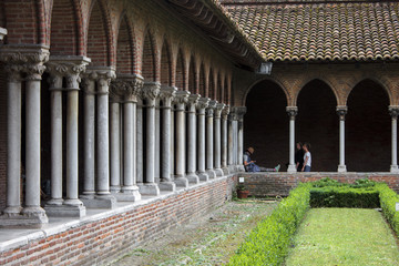 The cloister of the Church of the Jacobins in Toulouse, France. A southern gothic brick building.