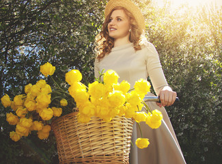 Fascinating girl. Portrait of beautiful and young woman in dress and hat looking away and smiling...