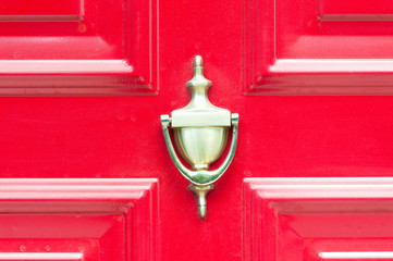 Door knocker, Golden vintage door knocker on old wooden red vintage doors with dust.