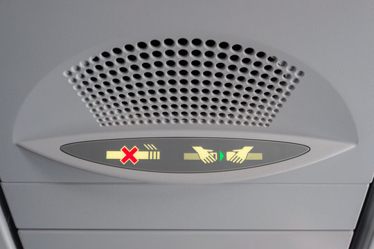 No Smoking and Fasten Seat belt Sign Inside an Airplane