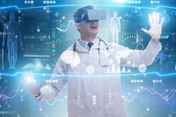 Doctor examining x-ray images using virtual reality glasses
