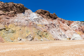 Huge colored rocks on Paleochori Beach located on the south shore of the island of Milos. Cyclades Islands, Greece.