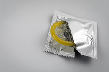 Condom close-up. Contraceptive protection from pregnancy, AIDS.