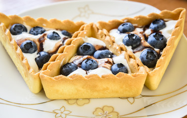 cakes with cream and berries