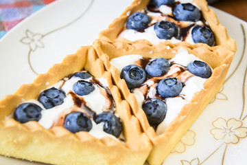 cakes with cream and berries