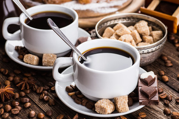 Two cups of espresso on brown napkin