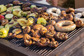 Assorted delicious grilled meat with vegetable over the coals on a barbecue
