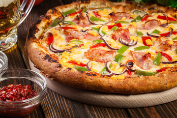 Homemade pizza with bacon, paprika and corn