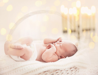 Newborn baby girl, 7 days old, sleeping on soft fluffy blanket