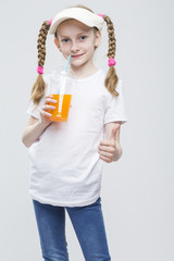 Portrait of Happy Smiling Caucasian Blond Girl in Visor Holding Cup of Juice and Showing Thumbs Up Sign.