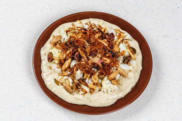 Hummus with olive oil and nuts