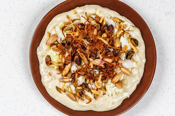 Hummus with olive oil and nuts