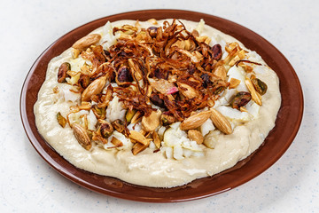 Hummus with olive oil and nuts