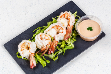 cooked shrimps on black slate