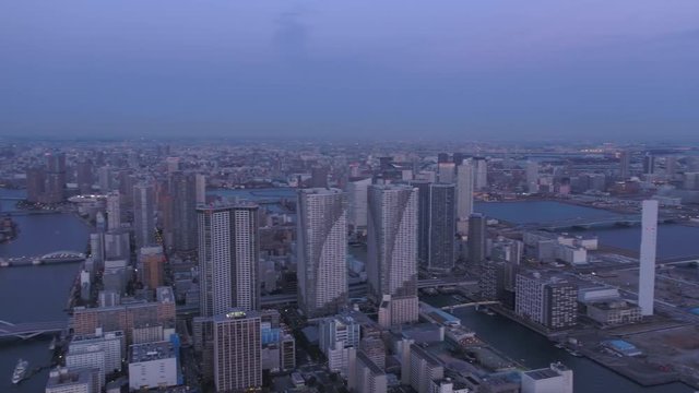 Japan Tokyo Aerial v45 Flying over harbor panning at dusk with cityscape views