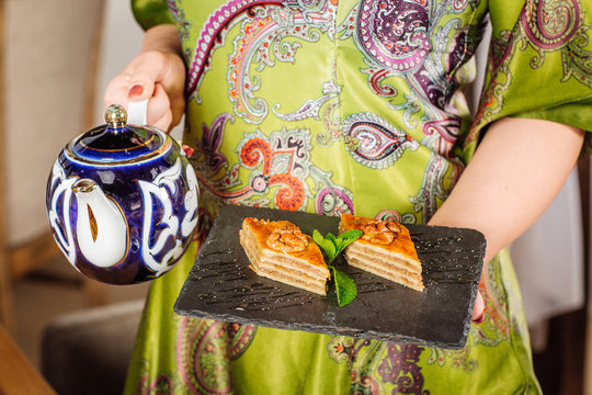hand holding Piece of baklava sweets