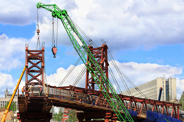 Cranes on the construction site of an industrial facility