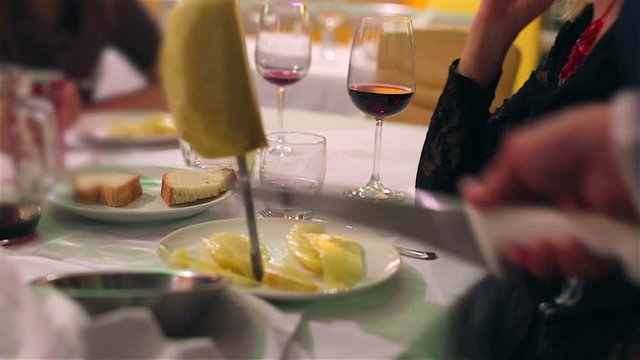 Pineapple slices with sword on set table in Brazilian Steakhouse Restaurant