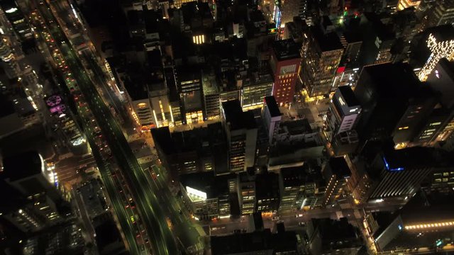 Japan Tokyo Aerial v50 Birdseye view flying low over Ginza area panning night 2/17