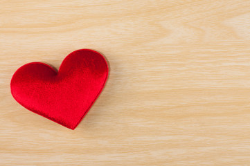 red heart shape on the wooden background